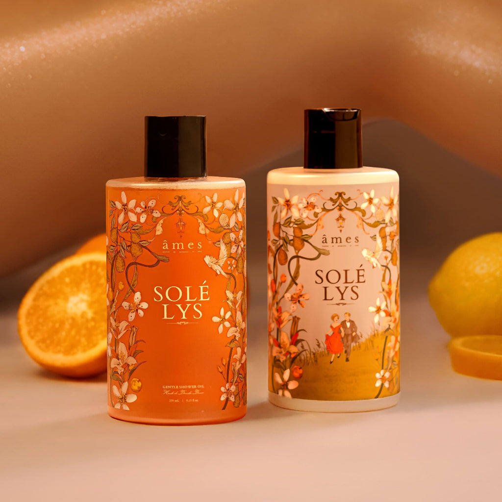 Gentle Shower Oil and Essential Lotion with oranges in the background